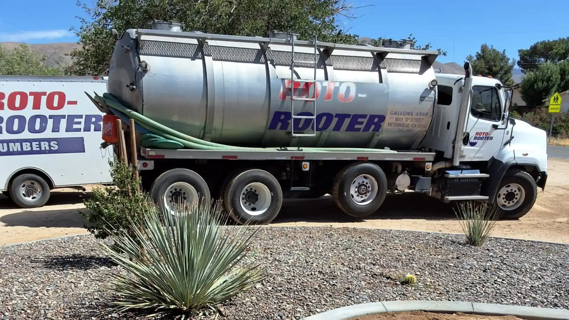Roto-Rooter septic pump truck servicing a residential property in the High Desert