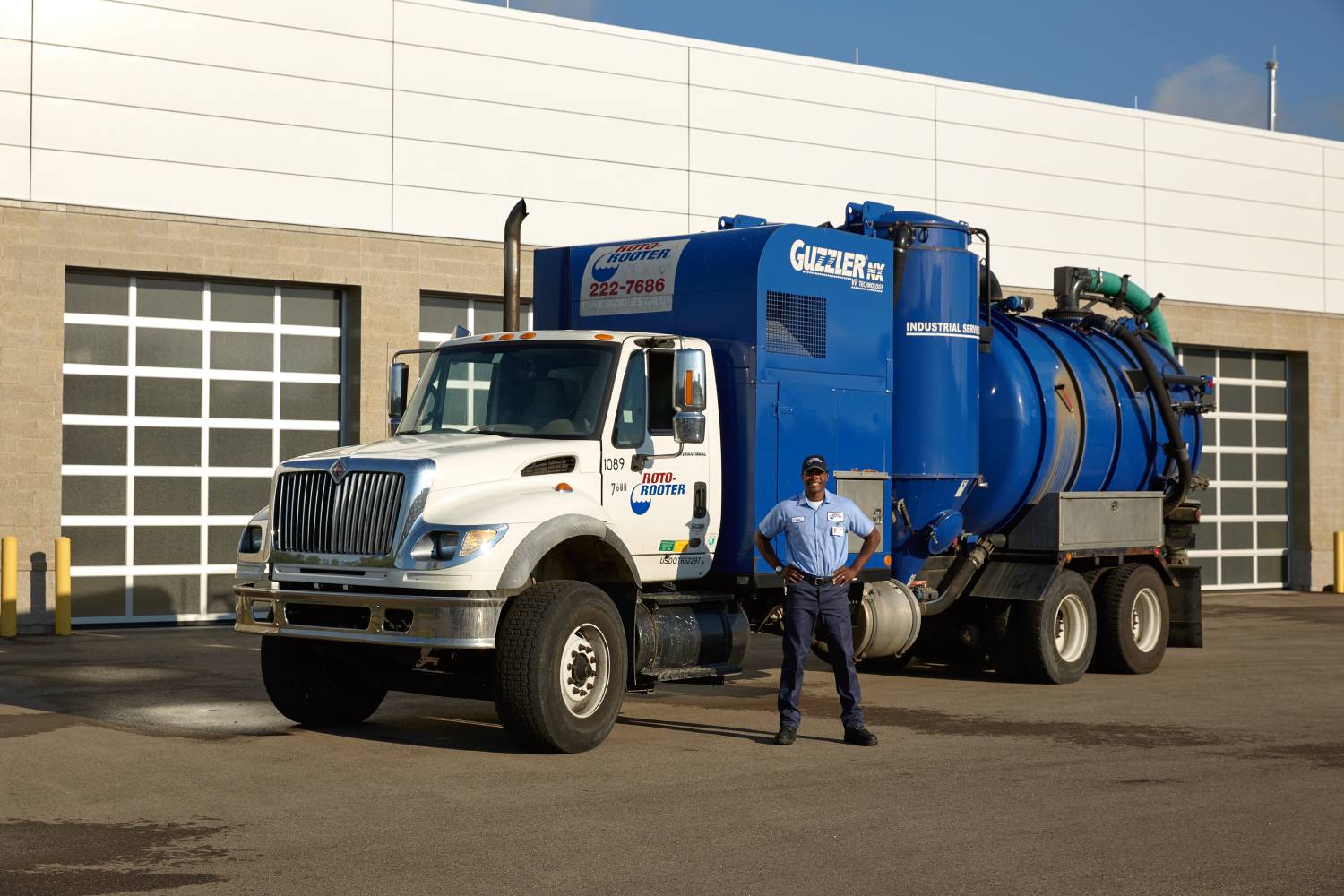 Roto-Rooter septic technician with vacuum truck at an Apple Valley property